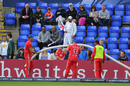 England players Steven Finn and James Tredwell search for a lost ball