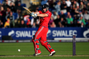 Jos Buttler smashes a four during his innings