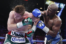 Canelo Alvarez reels from a Floyd Mayweather punch