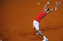 Novak Djokovic celebrates winning his singles rubber against Milos Raonic