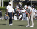 Tiger Woods gets a putting lesson from Steve Stricker