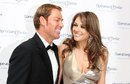 Shane Warne  and Liz Hurley at a media event