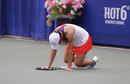 Francesca Schiavone falls to the ground after being beaten by Anastasia Pavlyuchenkova