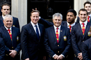 Manu Tuilagi sticks his fingers up behind Prime Minister David Cameron