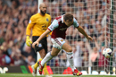 Mark Noble runs in celebration after scoring his penalty
