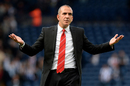 Paolo di Canio gestures to the Sunderland fans after his side's defeat