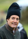 Actor Kyle MacLachlan tries to keep warm at the Alfred Dunhill Championship