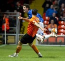 Kyle Lafferty is upended by Michael Kovacevic