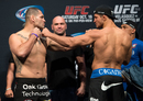 Heavyweight champion Cain Velasquez and Junior Dos Santos face off during the UFC 166 weigh-in