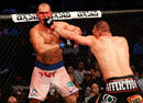Cain Velasquez punches Junior Dos Santos in their UFC heavyweight championship bout