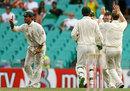 Ricky Ponting indicates to the umpire that the catch by Michael Clarke was clean