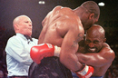 Mills Lane steps in as Mike Tyson bites Evander Holyfield on the ear