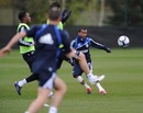 Ashley Cole plays a pass during a Chelsea training session