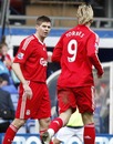 Steven Gerrard gestures at  Fernando Torres after he was substituted