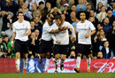 Gareth Bale, Jermain Defoe and Ryan Nelson celebrate a goal