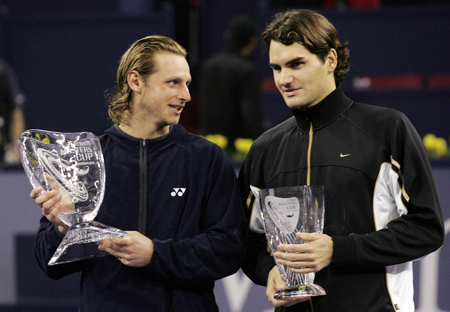 David Nalbandian and Roger Federer with the Tennis Masters Cup trophies