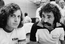 Guillermo Vilas and Ion Tiriac chat during a break in play