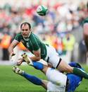 Ireland's Girvan Dempsey offloads against Italy