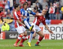 Wigan's Marcelo Moreno vies with Samir Nasri and Mikael Silvestre