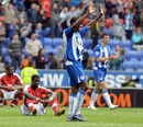 Emmanuel Eboue slumps to the ground in defeat
