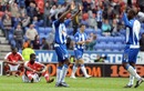 Wigan players celebrate their dramatic victory over Arsenal