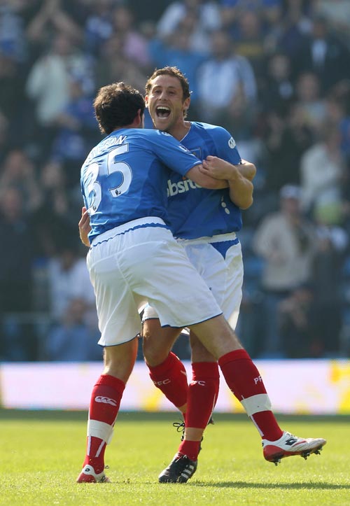 Michael Brown is congratulated after scoring Portsmouth's opening goal against Aston Villa