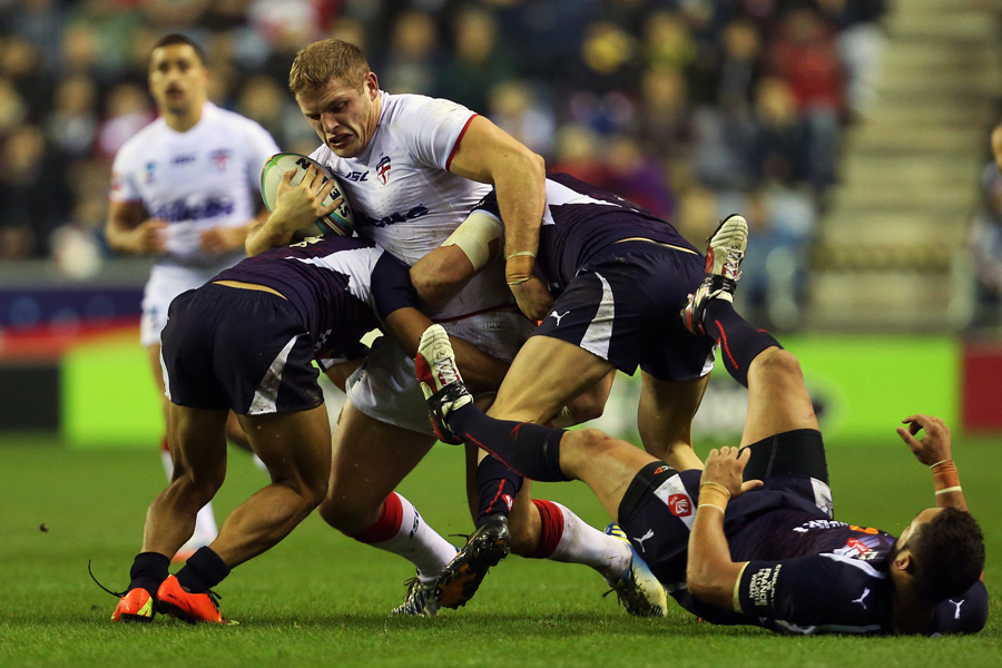England's George Burgess is tackled