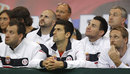 Novak Djokovic and the Serbian team watch on