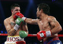 Manny Pacquiao lands a right jab on Brandon Rios during their WBO International Welterweight title fight