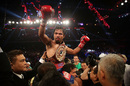 Manny Pacquiao is held aloft after beating Brandon Rios during their WBO International Welterweight title fight