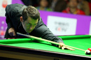 Ronnie O'Sullivan plays on a red