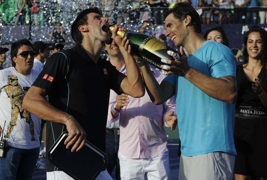 Novak Djokovic and Rafael Nadal enjoy some champagne after their exhibition match in Argentina