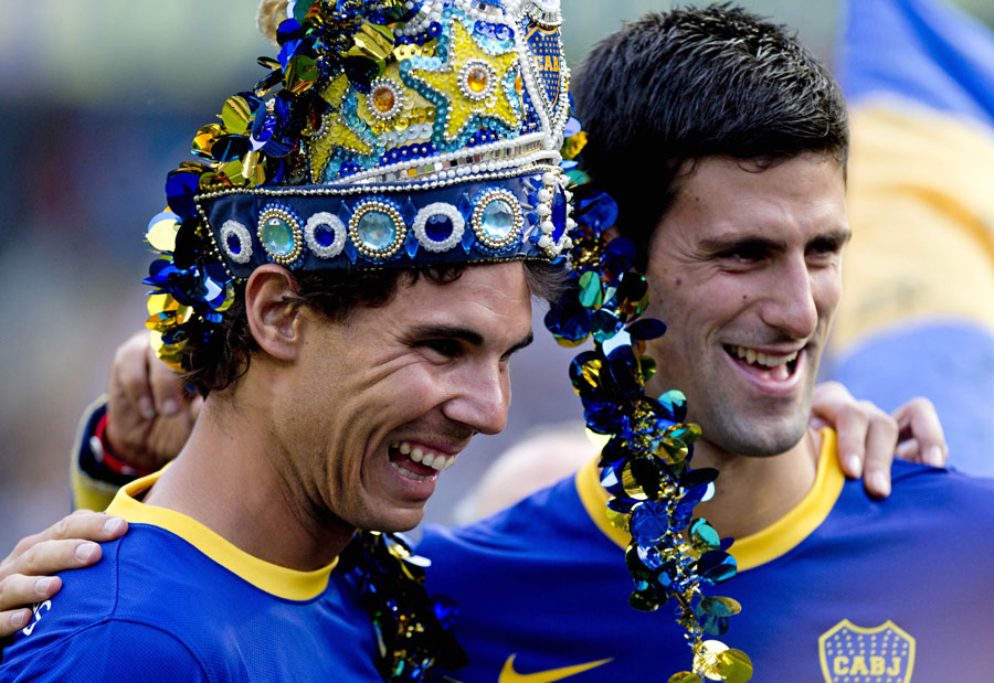 Rafael Nadal and Novak Djokovic pose wearing Boca Juniors kits