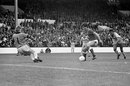 Neil Webb closes in on goalkeeper Kevin Poole