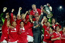 Alex Ferguson lifts the European Cup with his players