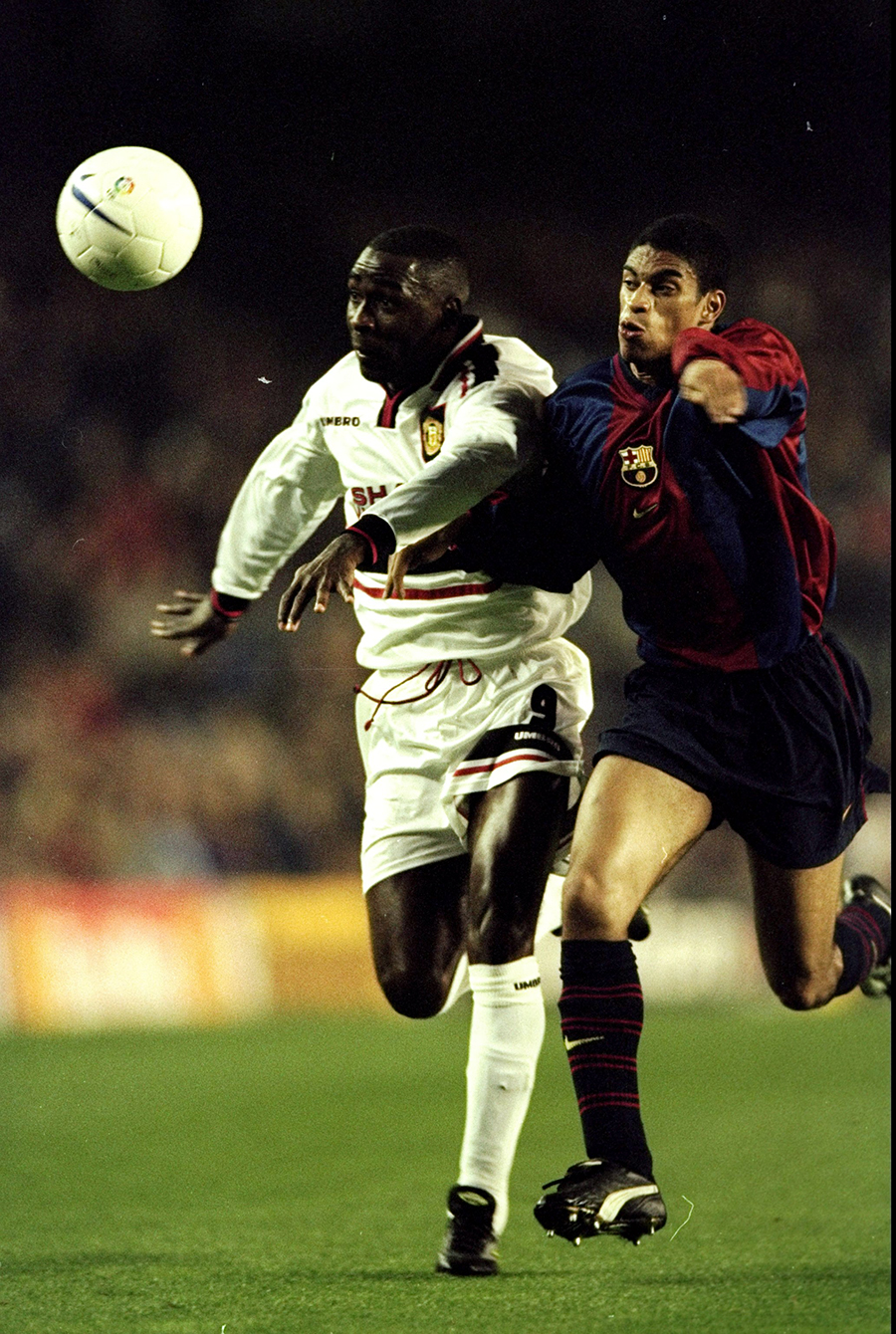 Andy Cole vies with Michael Reiziger