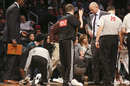 Jason Kidd looks on as the court is wiped clean