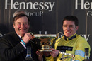 Nicky Henderson and Barry Geraghty lift the Hennessy Gold Cup