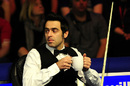 Ronnie O'Sullivan takes a sip out of his drink 