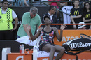 Venus Williams jokes during an exhibition match with sister Serena