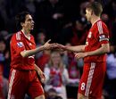 Yossi Benayoun and Steven Gerrard join hands