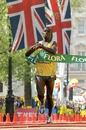 Sammy Wanjiru crosses the finish line to win the London Marathon