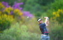 Louis Oosthuizen plays a shot during the first round