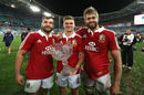 Alex Corbisiero, Owen Farrell and Geoff Parling hold the Tom Richards Cup as they celebrate after their victory
