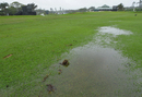 Water sits on the 18th fairway as the first round is suspended for a second time
