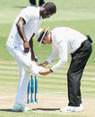 Darren Sammy is helped by the umpire