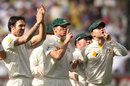 Mitchell Johnson, Peter Siddle and Michael Clarke taunt the England fans at the MCG on day one of the fourth Ashes Test