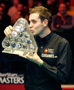 Mark Selby holds the Masters trophy after beating Ronnie O'Sullivan