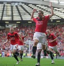 Michael Owen of Manchester United celebrates scoring against Manchester City