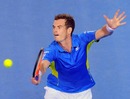 Andy Murray executes a volley